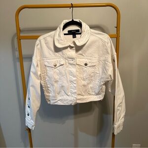Cropped white denim jacket with buttons up the sleeve